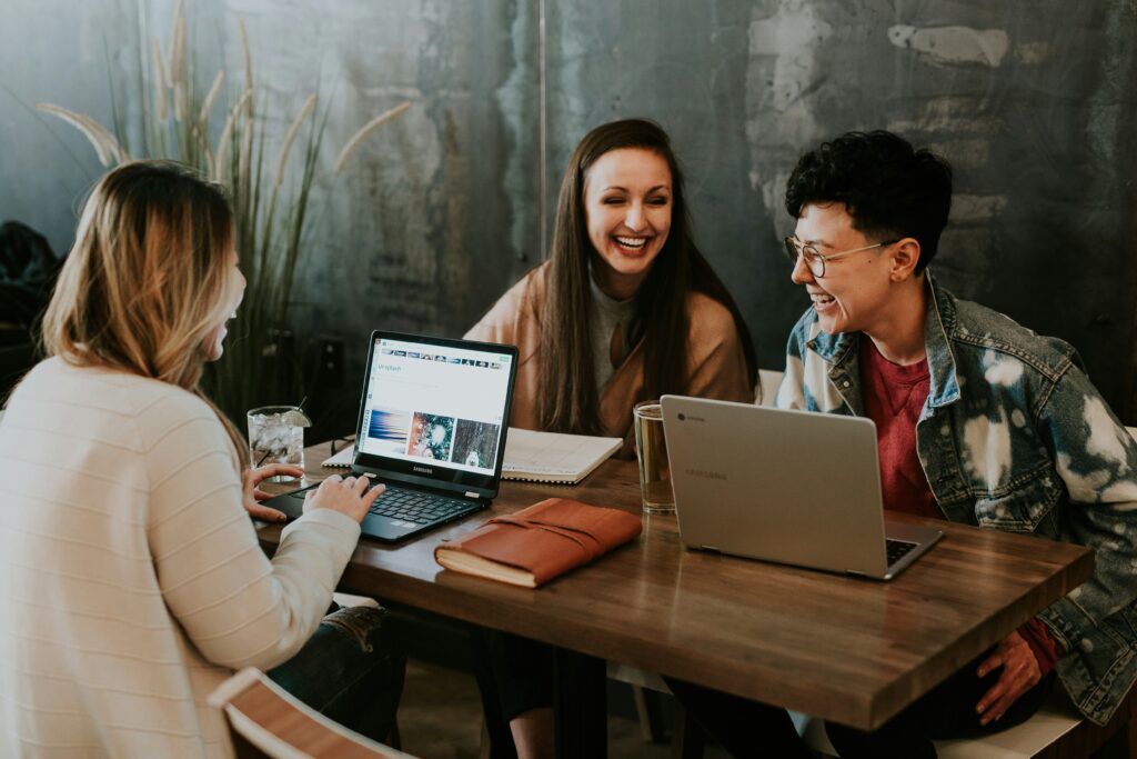 Young professionals reviewing the top 15 finance tips for people in their 20s.