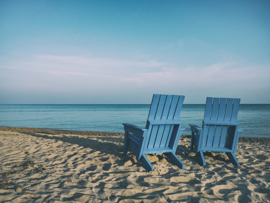 Retired couple on the beach after using their Roth IRA.